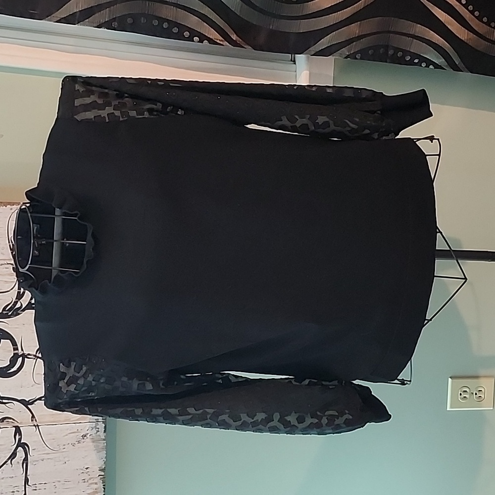 Black sweater with sheer glitter sleeves